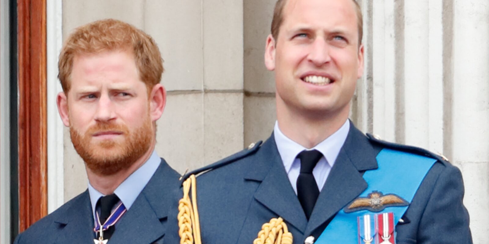 Prince Harry and Prince William watch a flypast to mark the centenary of the Royal Air Force from the balcony of Buckingham Palace on July 10, 2018 in London, England.