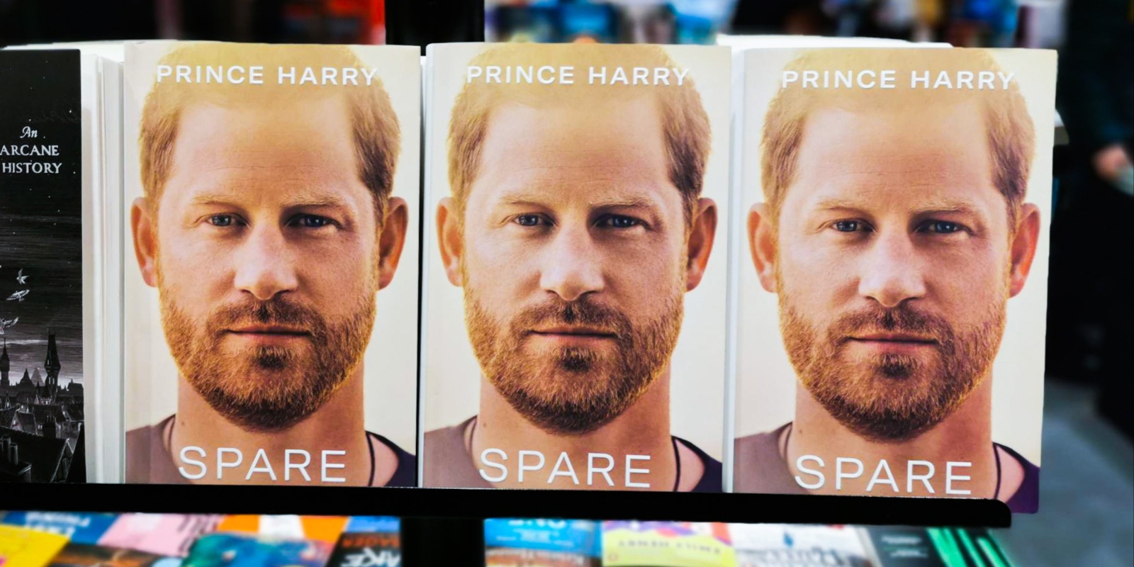 Three copies of Prince Harry's book 'Spare' on display at a bookstore.