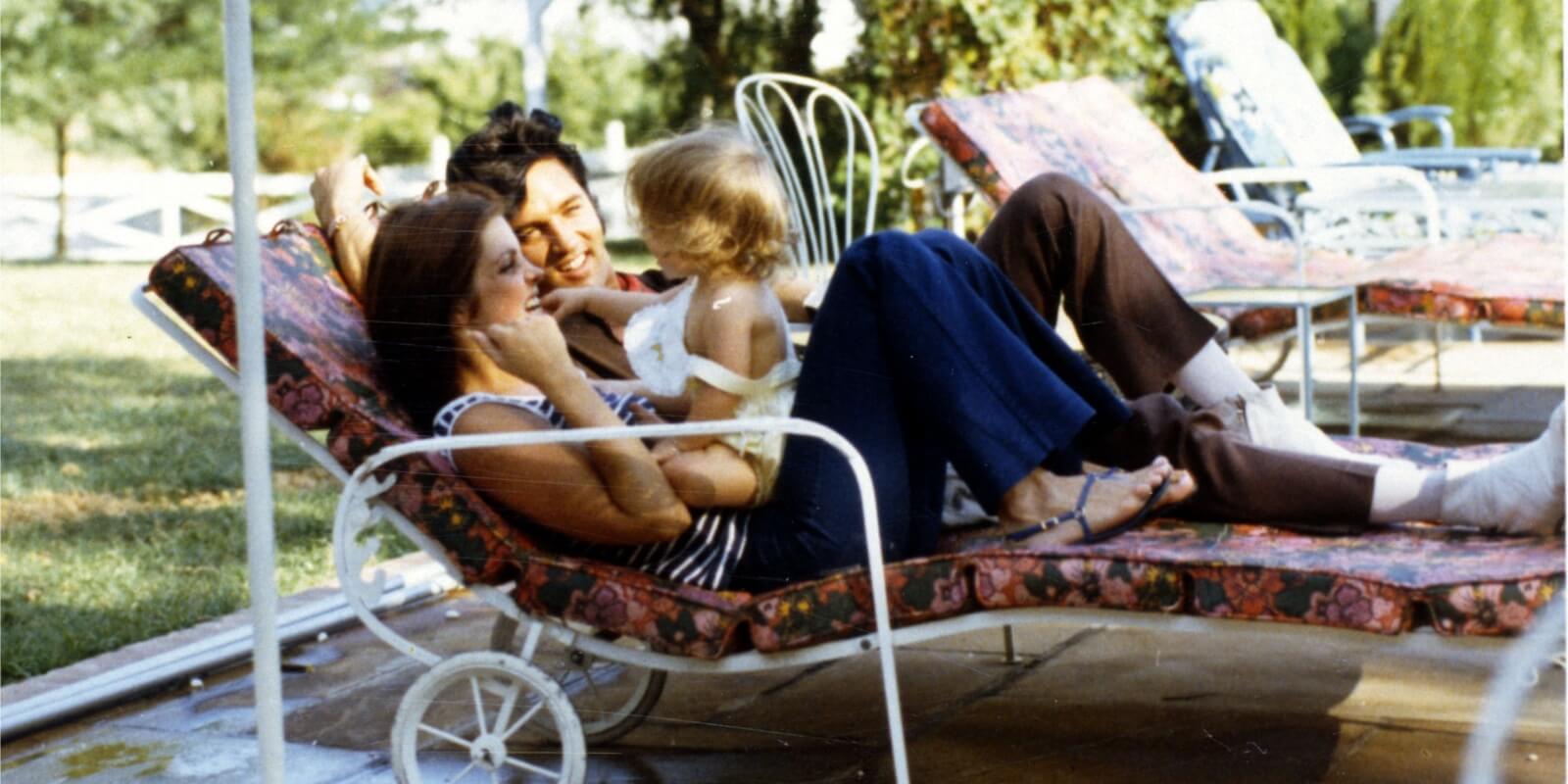 Lisa Marie Presley as a toddler photographed with her mother, Priscilla Presley and father, Elvis Presley, at Graceland.