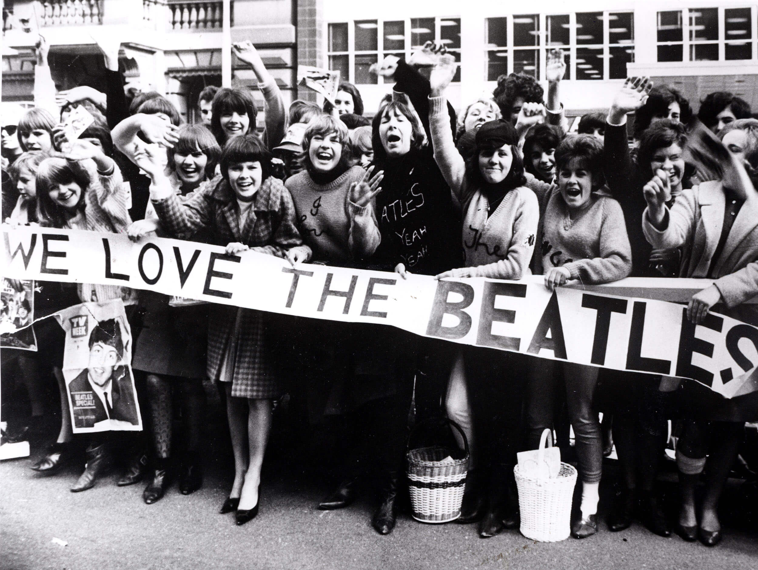 Beatles fans with a banner