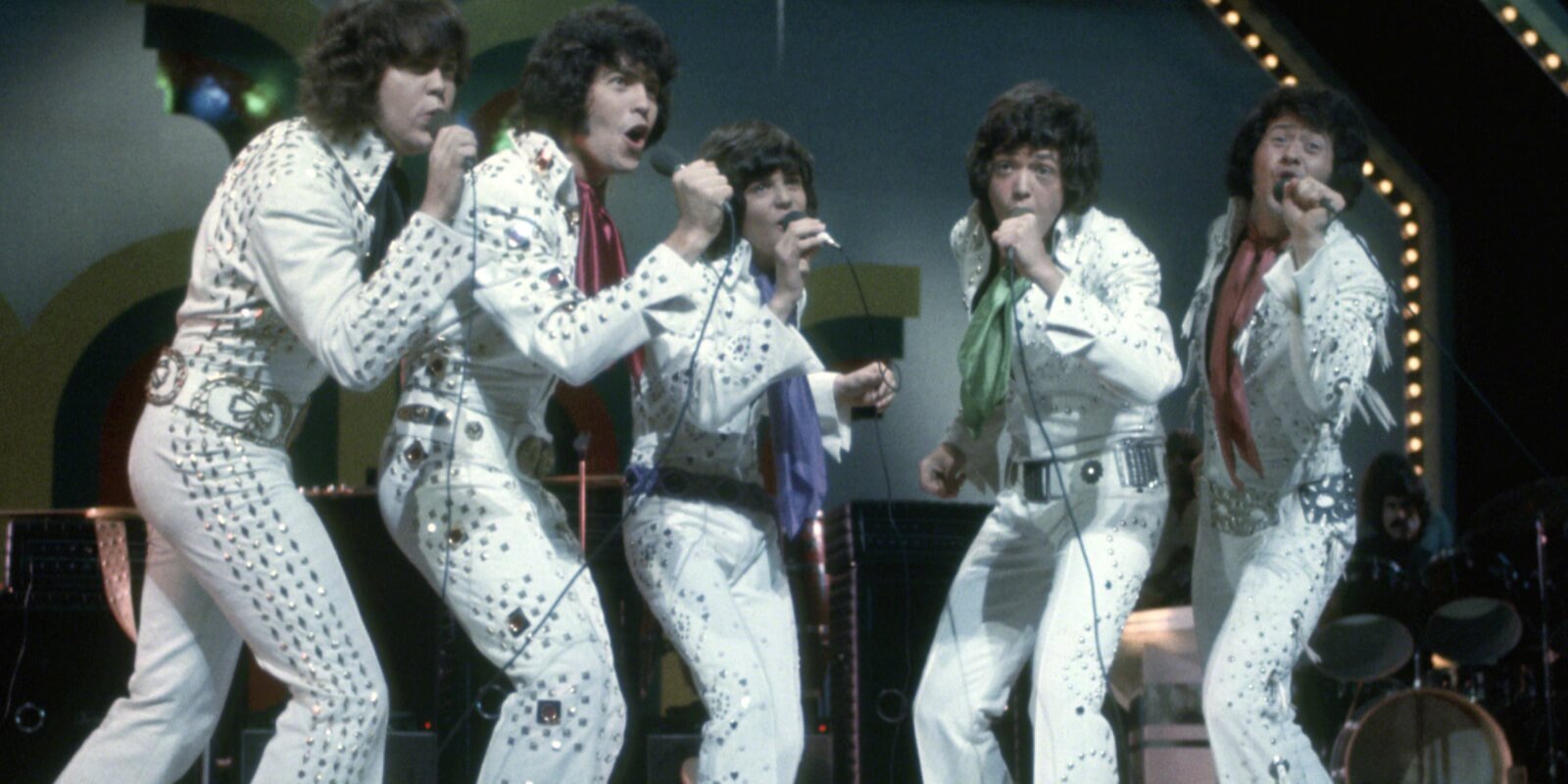 Alan, Merrill, Donny, Jay and Wayne Osmond in their Elvis-inspired jumpsuits during a performance in 1973.