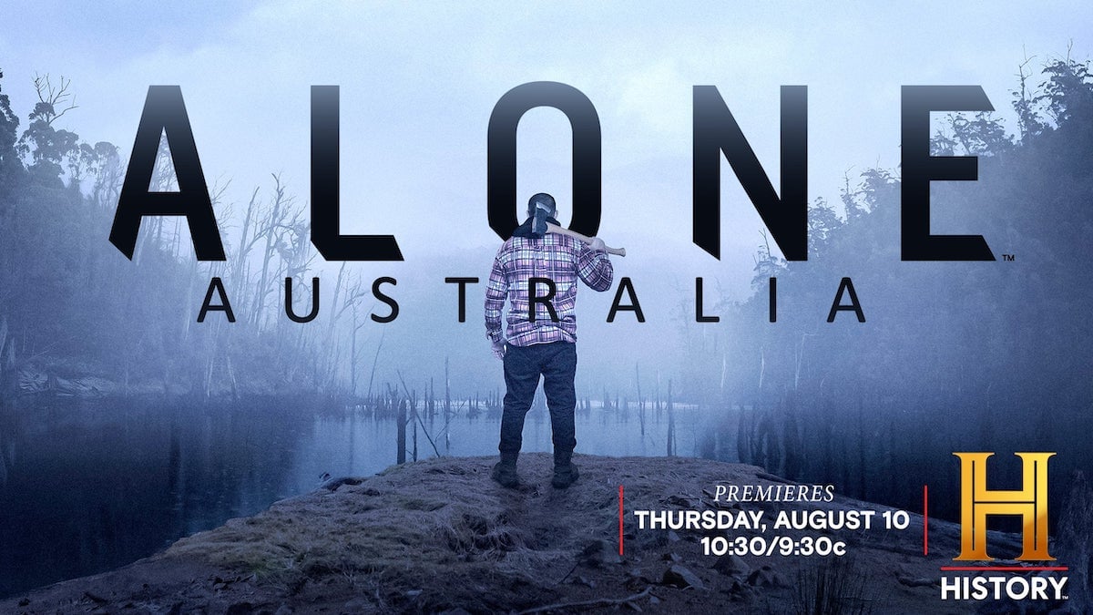 Image of a man holding an ax with his back to the camera for 'Alone Australia'