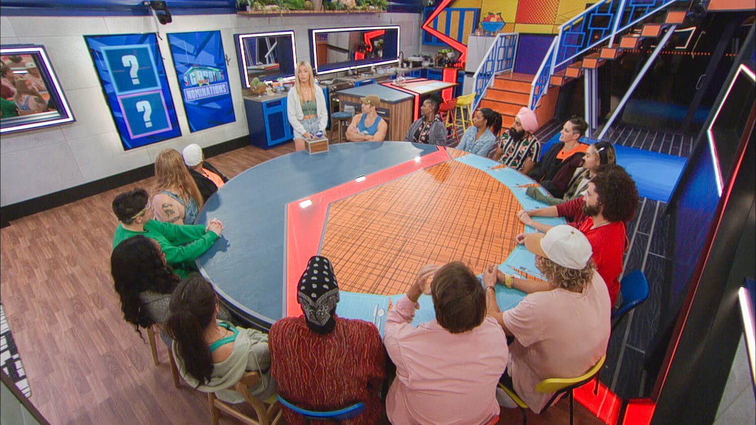 'Big Brother' Season 25 Week 1 houseguests around a round table with Reilly standing and speaking