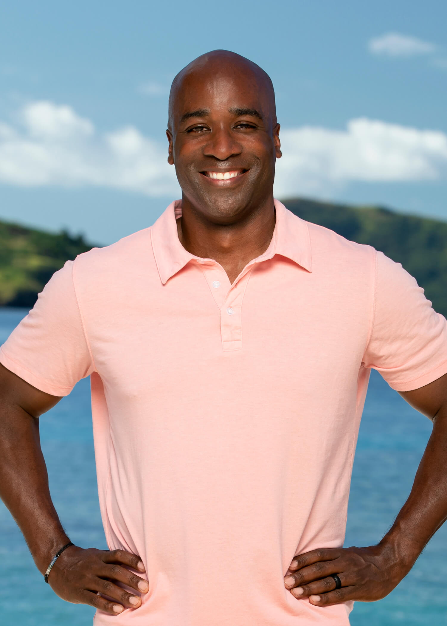 'Survivor 45' cast member Bruce Perreault smiling with his hands on his hips