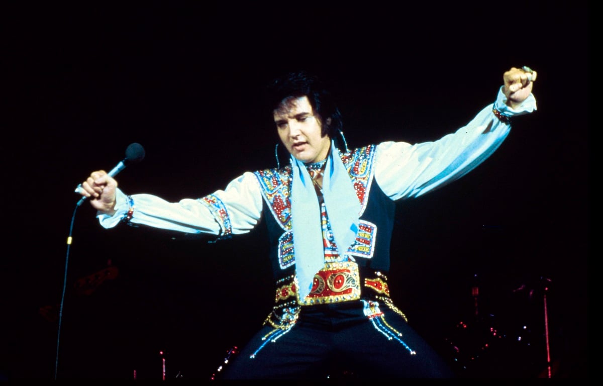 Elvis Presley, who has grandchidren he never got to meet, performing onstage in New York (circa 1975)