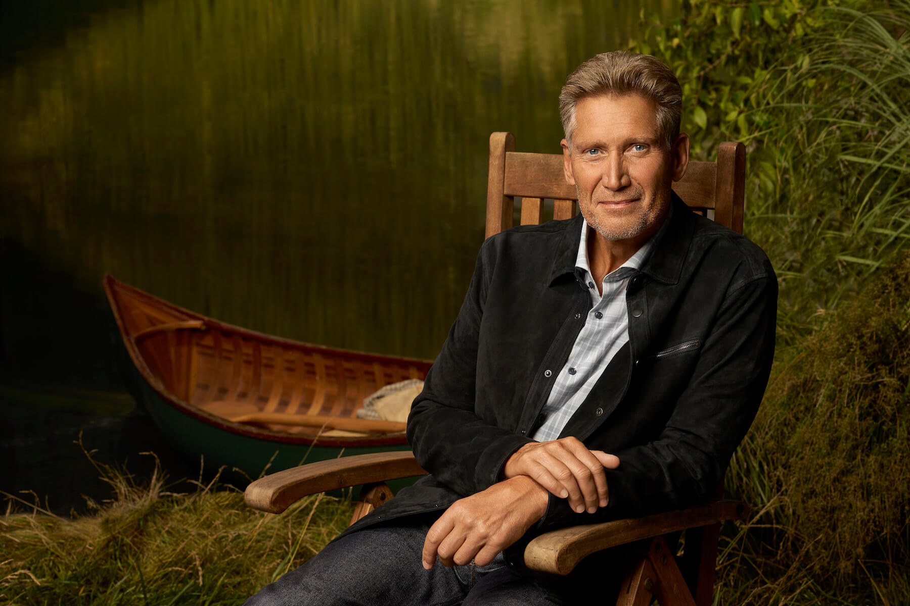 Gerry Turner, the star of 'The Golden Bachelor,' sitting in a chair