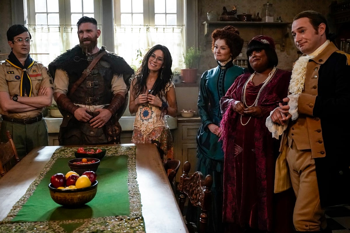 Pete, Thorfinn, Flower, Hetty, Alberta and Isaac stand around the kitchen table in 'Ghosts'