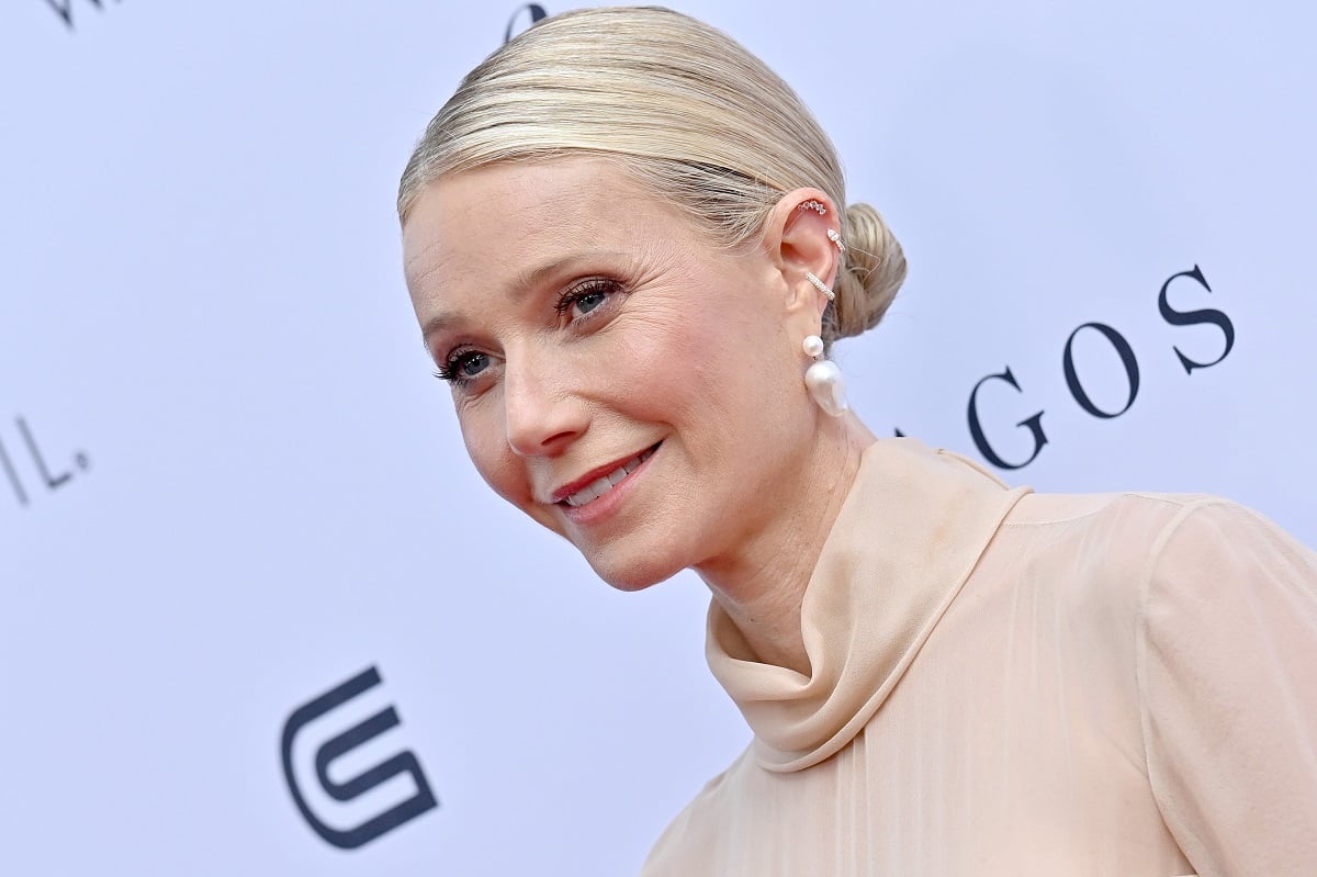 Gwyneth Paltrow posing in a turtle neck at the Daily Front Row's 7th Annual Fashion Los Angeles Awards.