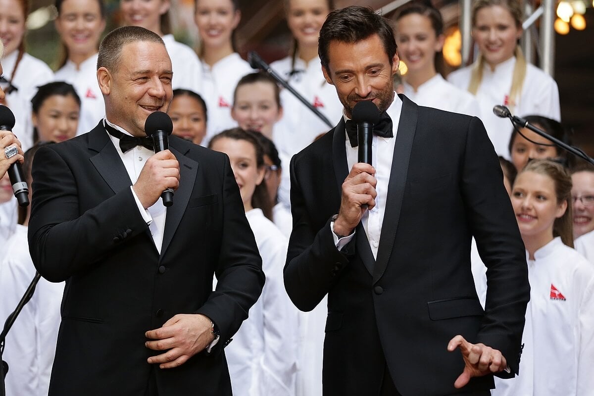 Hugh Jackman and Russell Crowe share a joke on the red carpet during the Australian premiere of 'Les Miserables'.