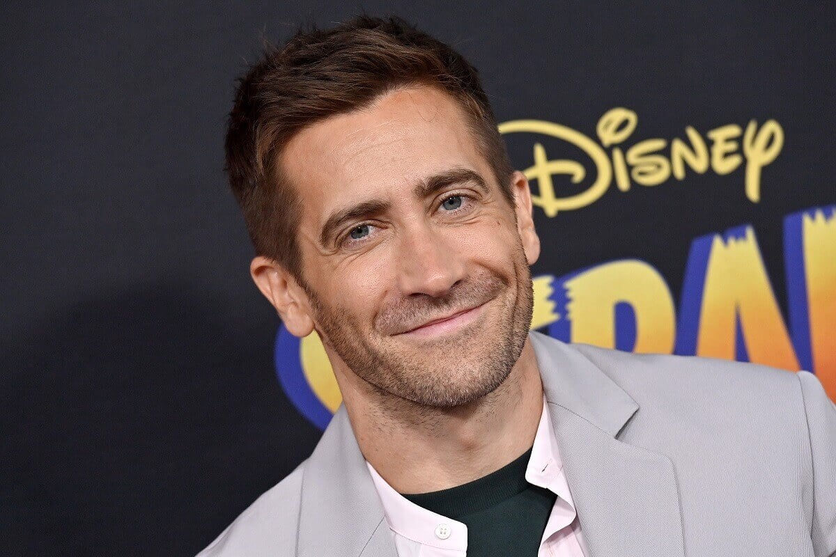 Jake Gyllenhaal smiling at the premiere of 'Strange World'.