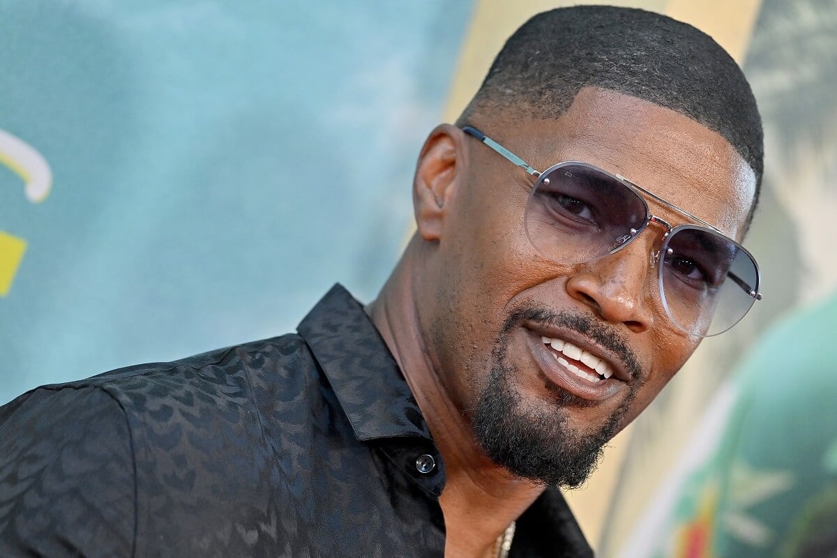 Jamie Foxx in sunglasses posing for a picture at the World Premiere of Netflix's 'Day Shift.'