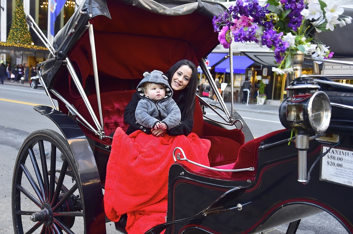 Jenelle Evans is seen in a horse-drawn carriage with her son, Kasier Griffith, in 2015