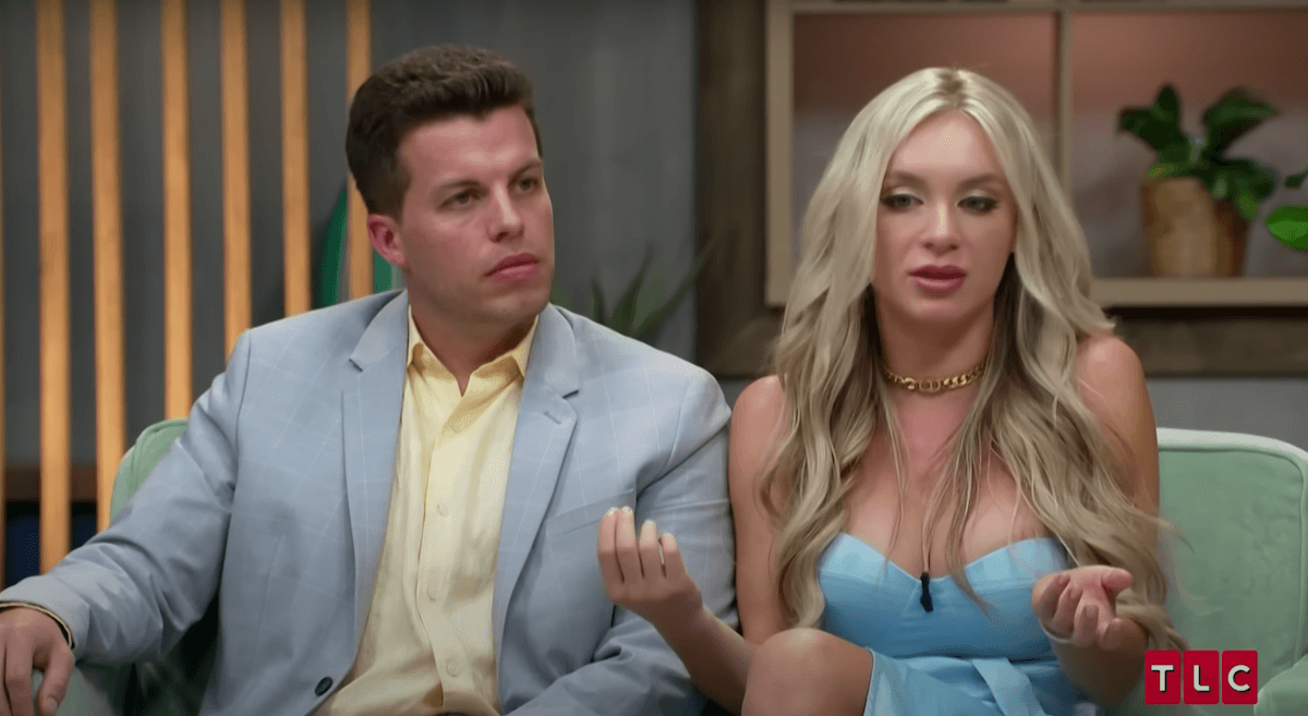 Jovi and Yara of '90 Day: The Last Resort' sitting on a couch during an appearance at a '90 Day Fiance' reunion.