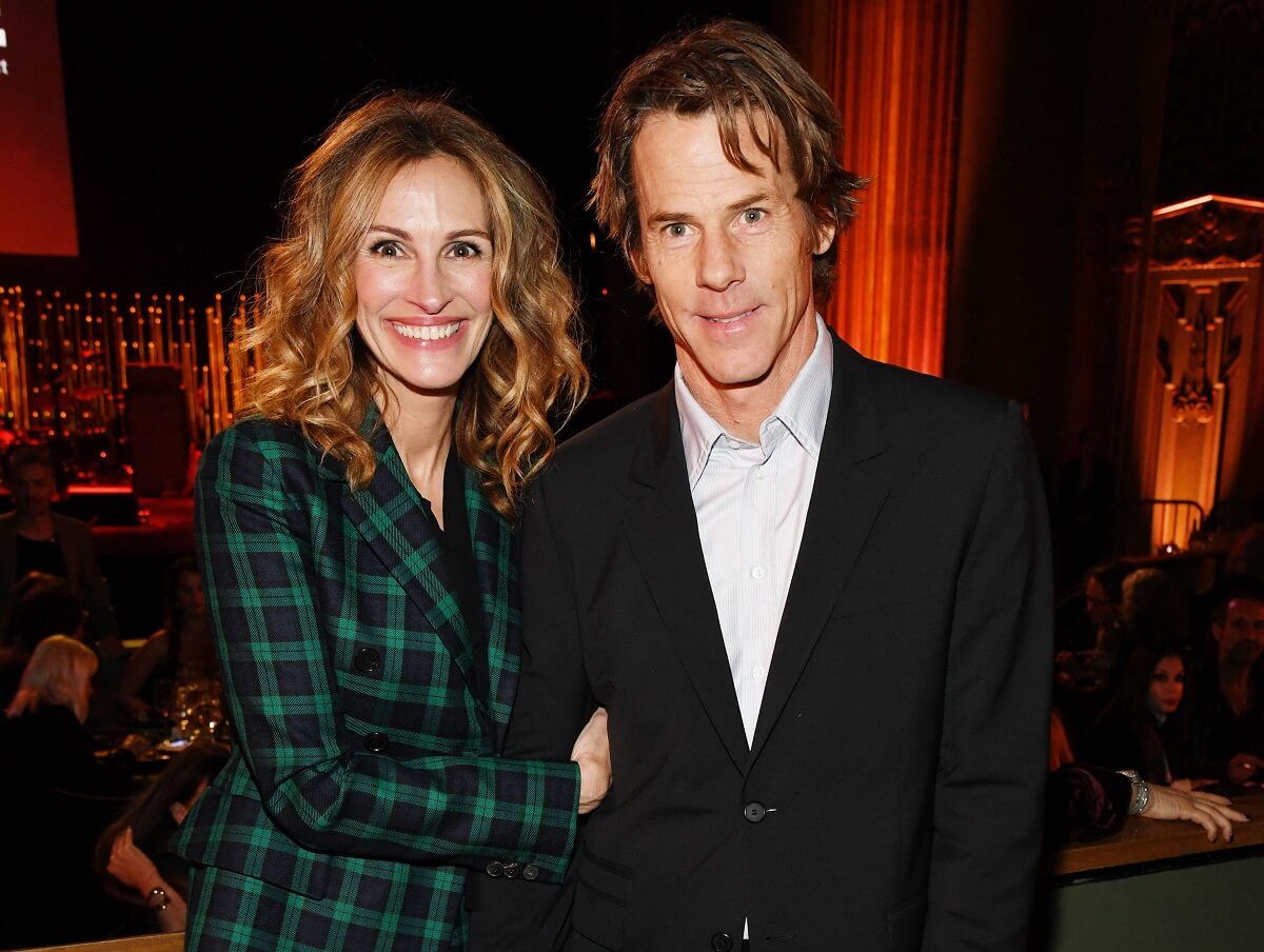 Julia Roberts and her husband, Daniel Moder, smile for photos at the CORE Gala