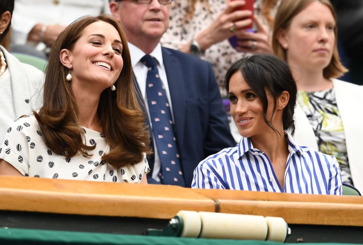 Kate Middleton and Meghan Markle attend day 12 of the 2018 Wimbledon Lawn Tennis Championships