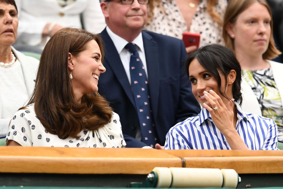 Kate Middleton and Meghan Markle share a laugh during 2018 Wimbledon Lawn Tennis Championships