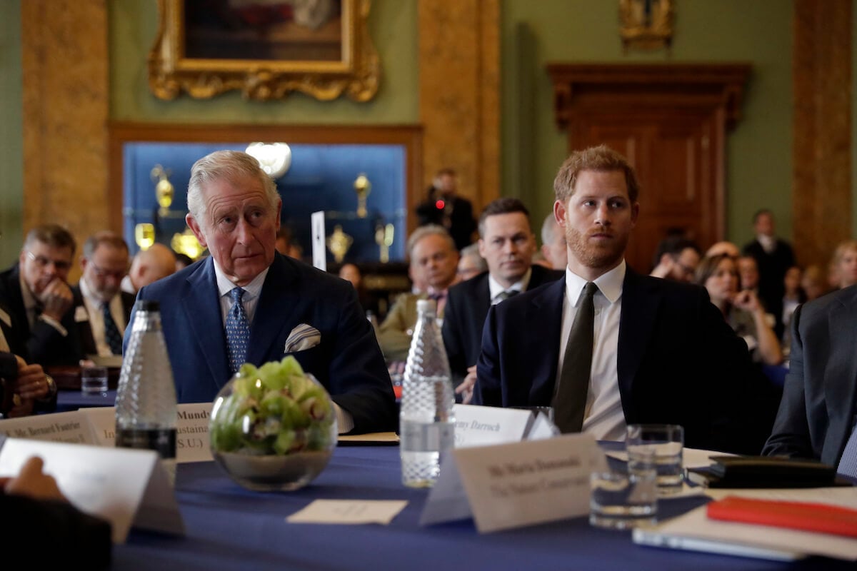 King Charles III, who reportedly wants Prince Harry to keep family matters private, sits with his youngest son