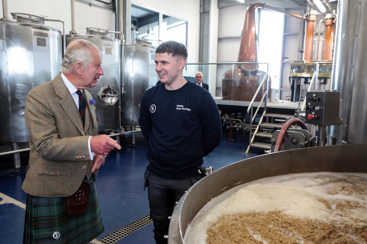 Britain's King Charles III (L) takes part in a visit of the 8 Doors Distillery in John O'Groats, Wick, in the Scottish Highlands, on August 2, 2023