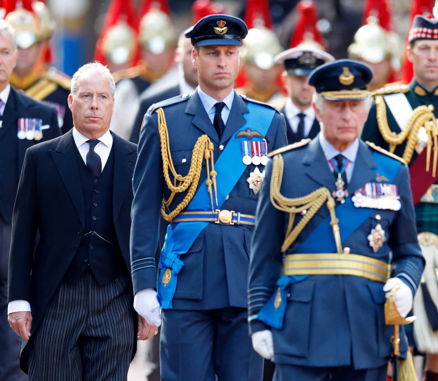 King Charles with Prince William behind him and David Armstrong-Jones, Earl of Snowden, behind both of them. King Charles and Prince William are both in uniform