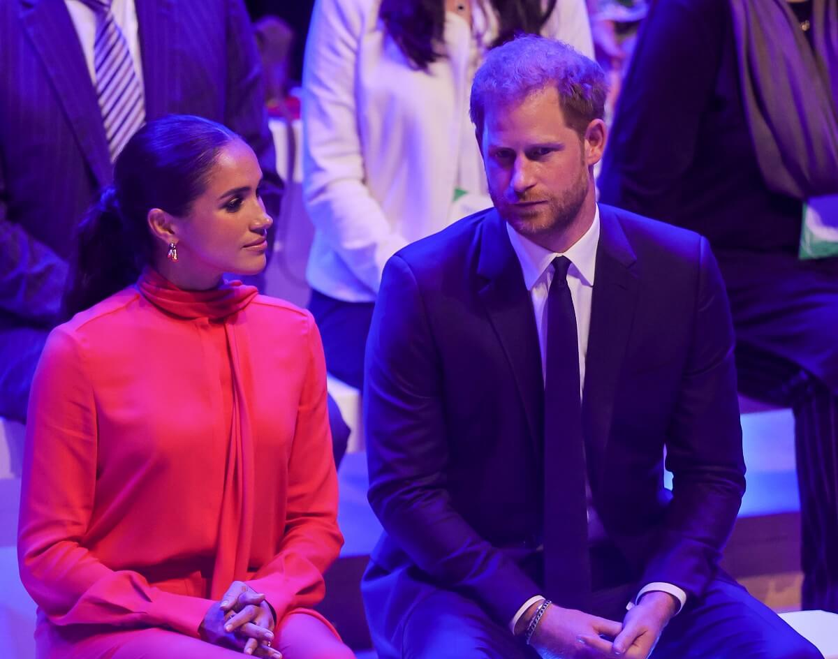 Meghan Markle and Prince Harry seated during the Opening Ceremony of the One Young World Summit