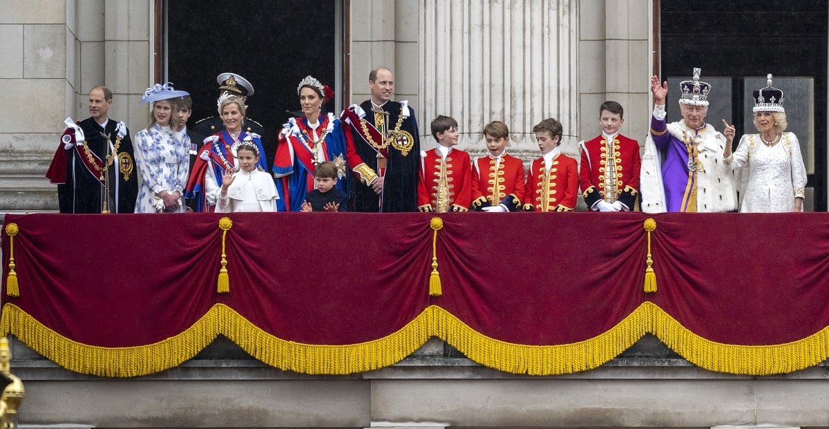 Members of the royal family, who an ex-employee says have something to 'prove' or will become 'extinct,' standing on Buckingham Palace balcony following King Charles III'scoronation ceremony