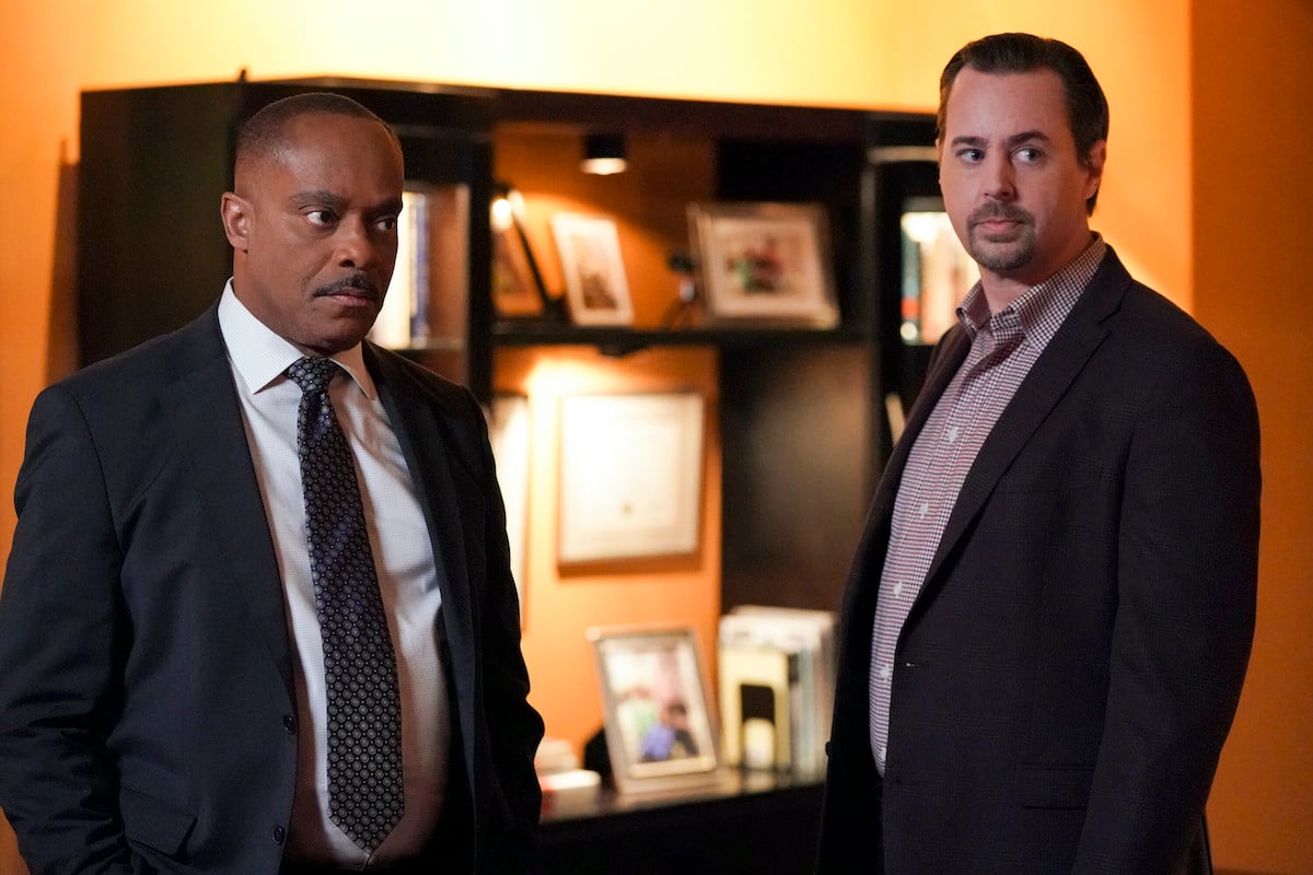Leon Vance and Timothy McGee standing next to each other in an office in the 'NCIS' Season 20 finale