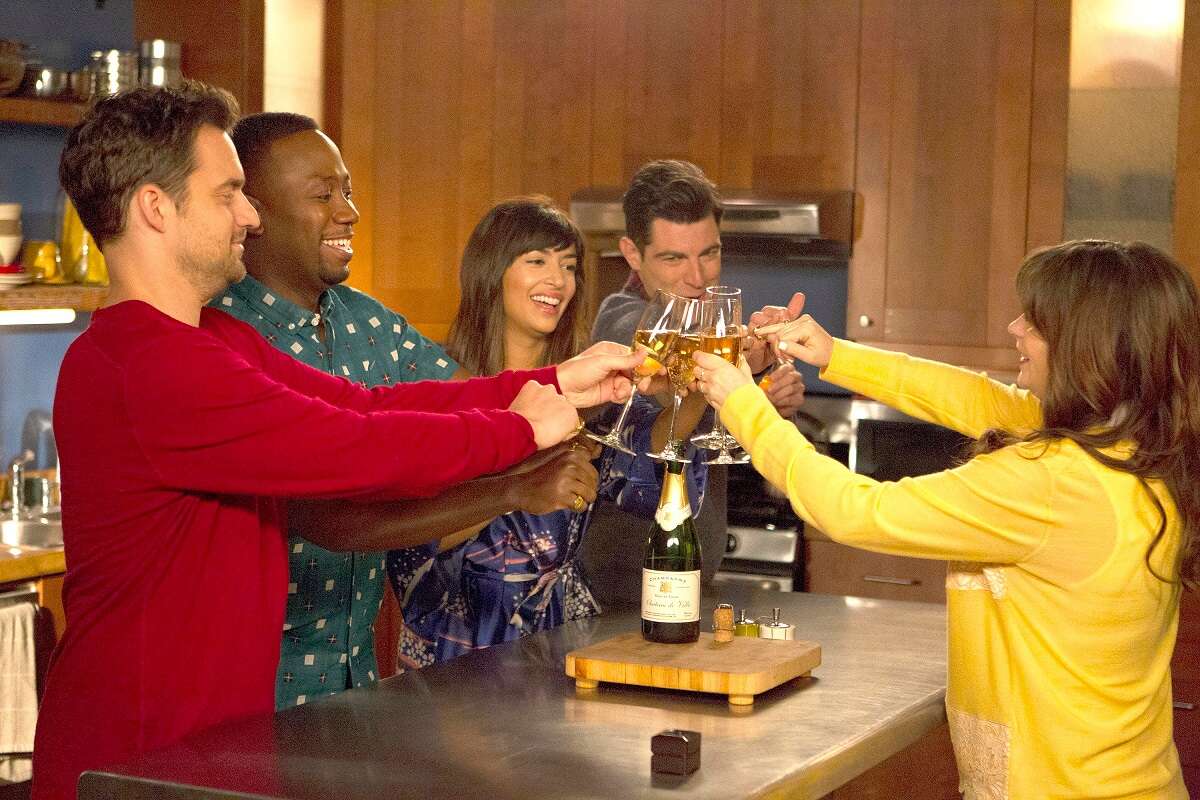 Nick, Winston, Cece, Schmidt and Jess cheers in the loft on an episode of 'New Girl'