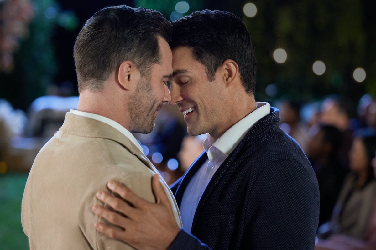 Luke Macfarlane and Peter Porte about to kiss in 'Notes of Autumn' part of the September 2023 Hallmark movie schedule