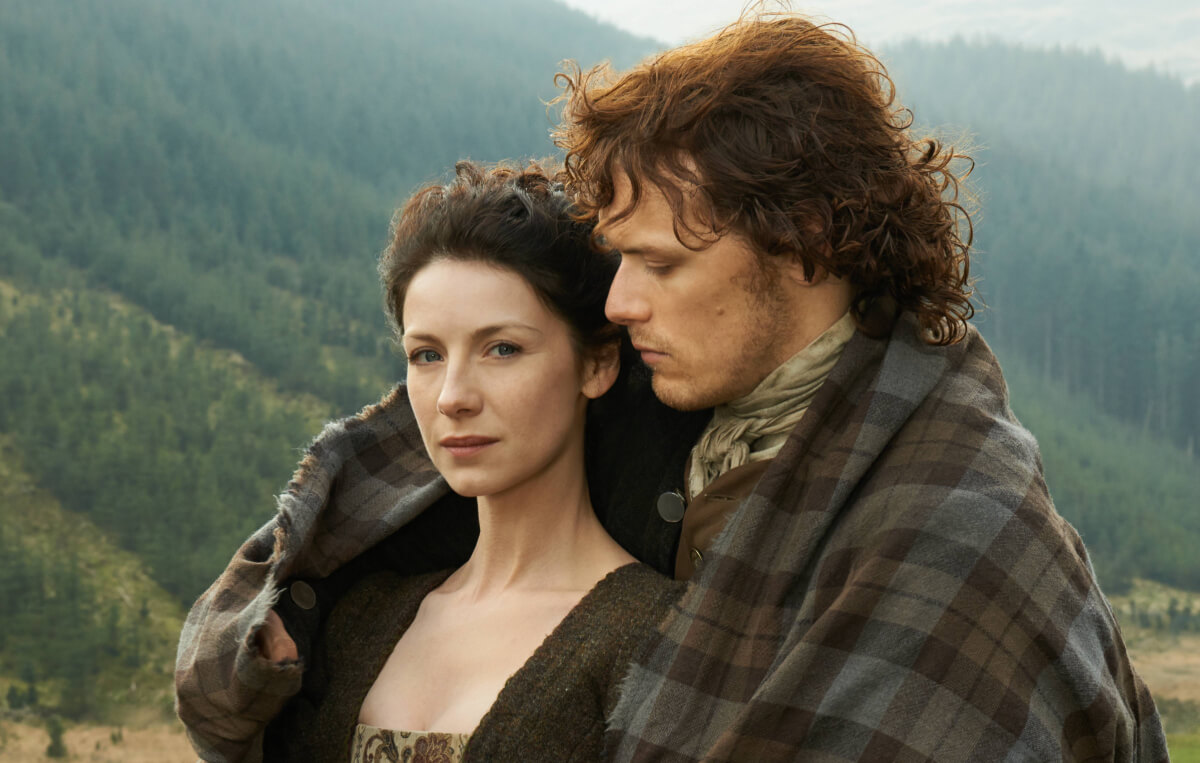Outlander stars Caitriona Balfe and Sam Heughan as Jamie and Claire Fraser in an image from season 1