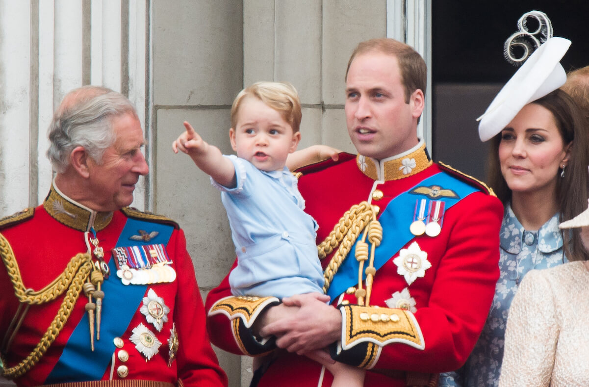 Prince William holds Prince George in 2015