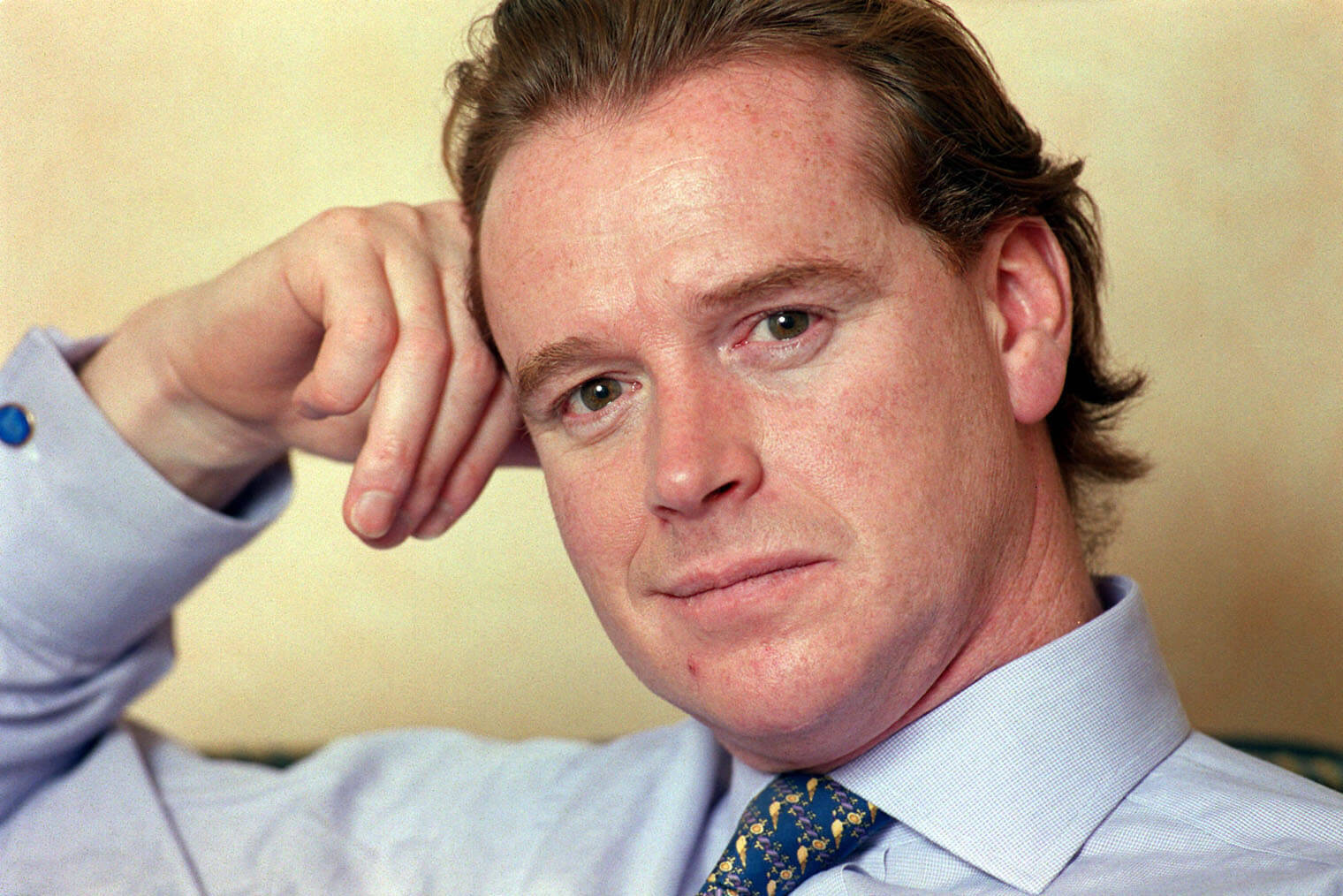 James Hewitt, Princess Diana's lover and Prince Harry's rumored real father, leaning his head against his hand