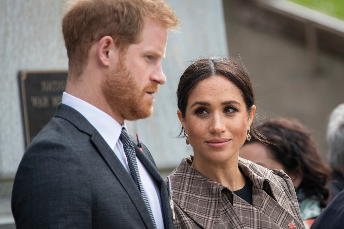 Prince Harry, Duke of Sussex and Meghan, Duchess of Sussex lay ferns and a wreath at the tomb of the Unknown Warrior at the newly unveiled UK war memorial and Pukeahu National War Memorial Park, on October 28, 2018, in Wellington, New Zealand