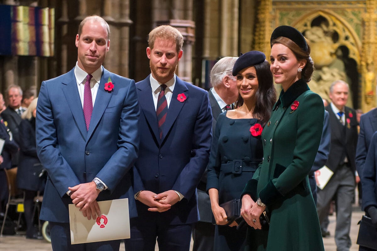 Prince Harry and Meghan Markle, who are 'clearly trying to make amends' with Prince William and the royal family by getting a place at Kensington Palace, stand with Prince William and Kate Middleton