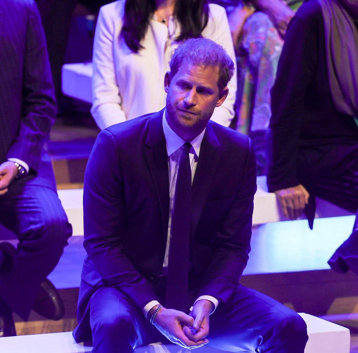 Prince Harry watching as Meghan Markle makes the keynote speech during the Opening Ceremony of the One Young World Summit 2022