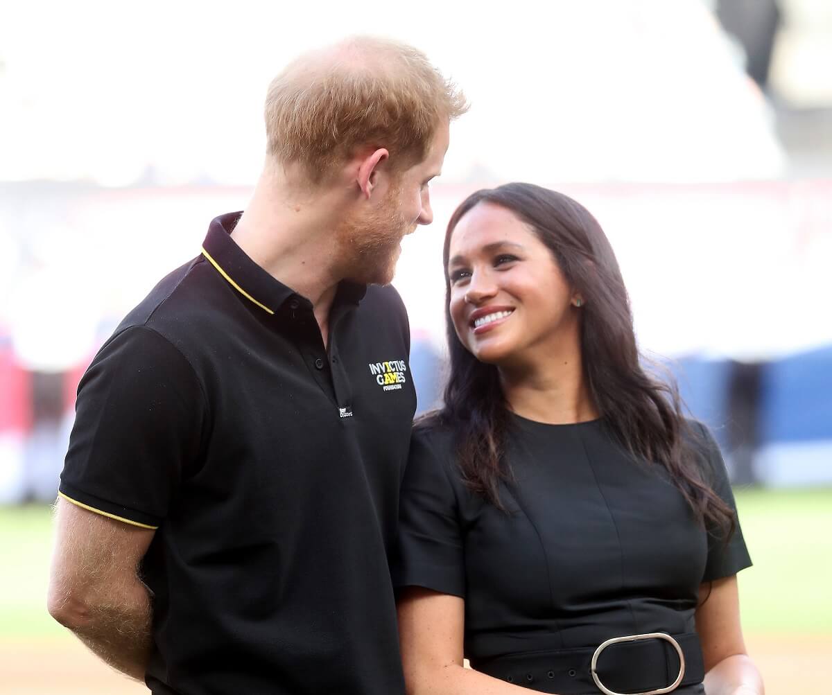 Prince Harry, who a body language expert says has finally 'found his princess' in Meghan Markle, attend a Major League Baseball game at the London Stadium