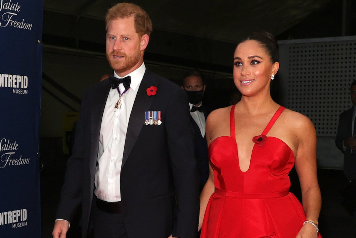 Prince Harry, who looked 'needy' in a scene from 'Heart of Invictus' during the Salute to Freedom Gala, walks with Meghan Markle