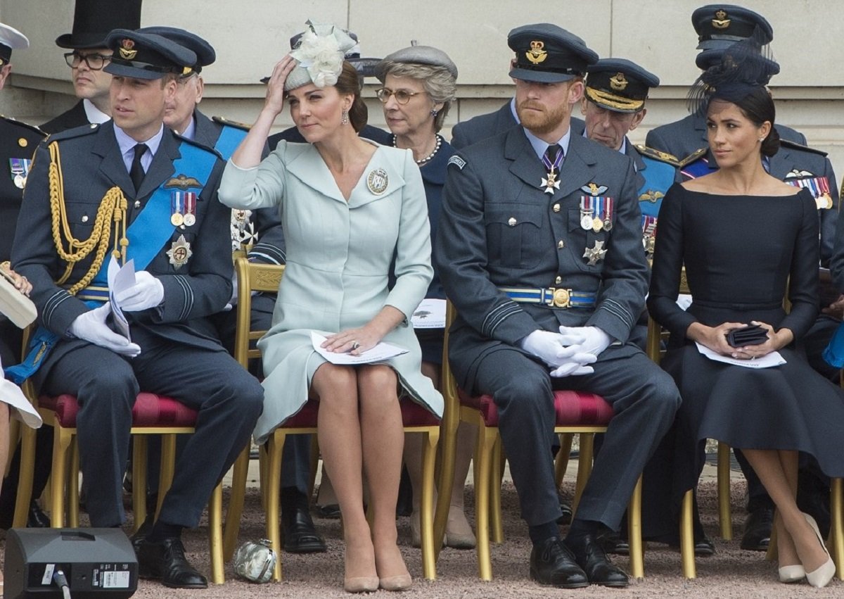 Prince William, Kate Middleton, Prince Harry, and Meghan Markle, who body language expert says were all part of the most tense royal family moment ever, during the RAF 100 ceremony at Buckingham Palace