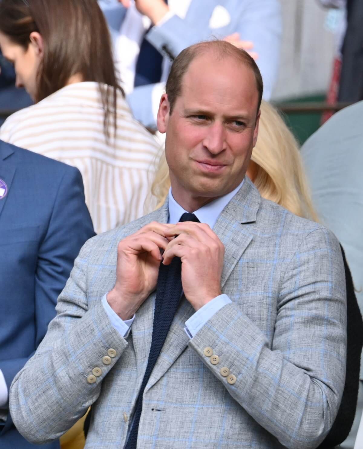 Prince William looks on as Carlos Alcaraz is presented with the Wimbledon gentlemen's singles trophy