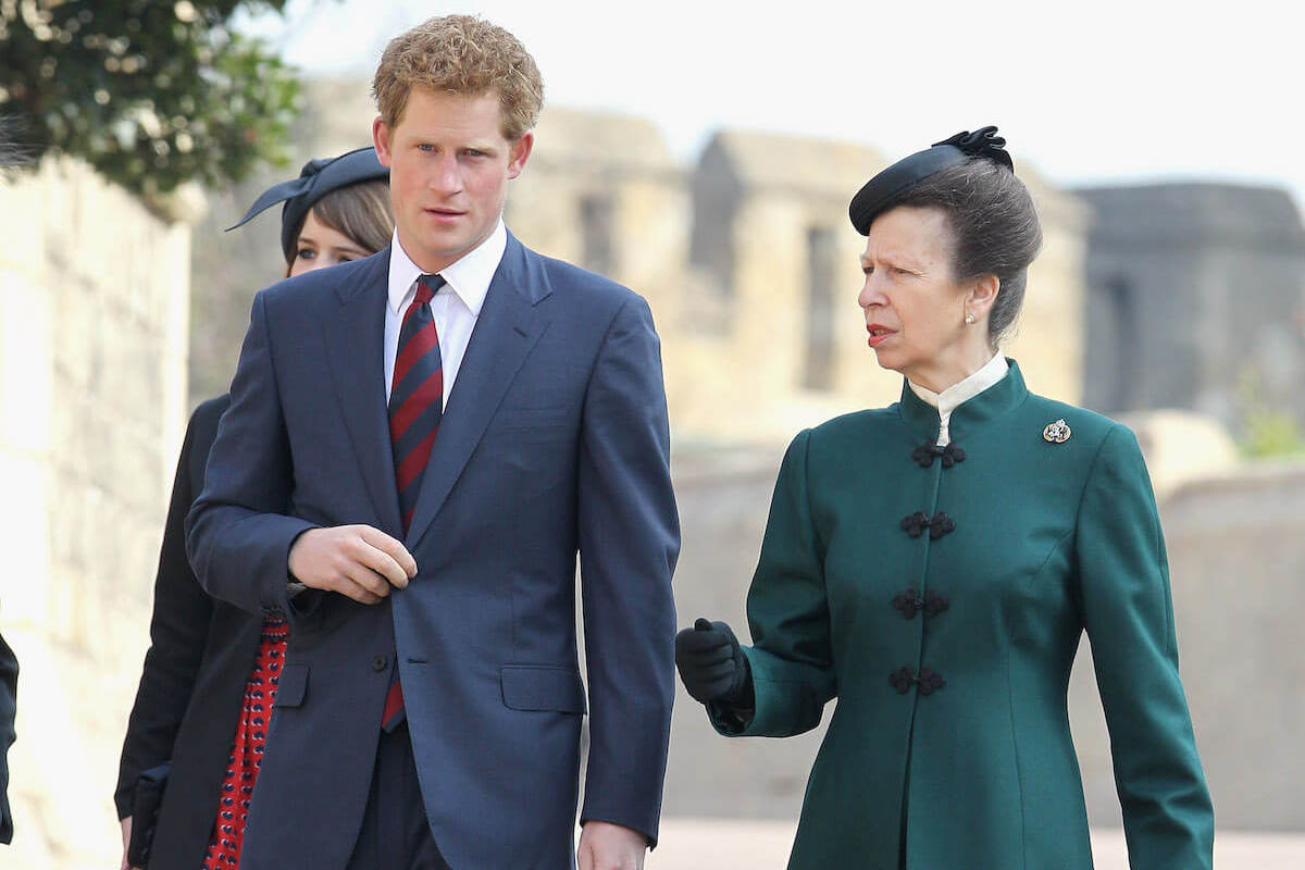 Princess Anne, who may be 'empathetic' toward Prince Harry, walks with her nephew