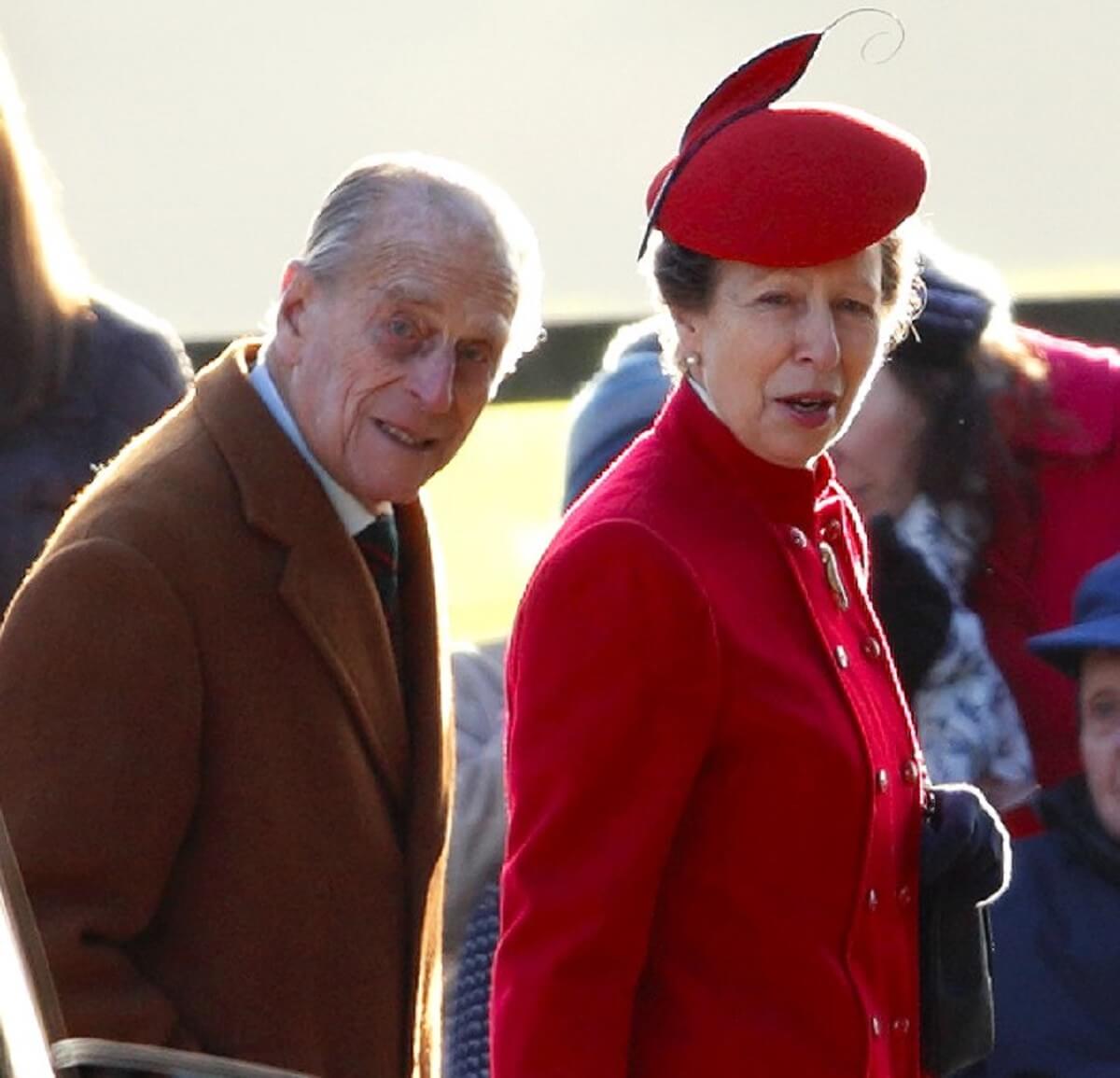 Princess Anne with her father, Prince Philip, arriving at St. Mary Magdalene Church to attend a Sunday service