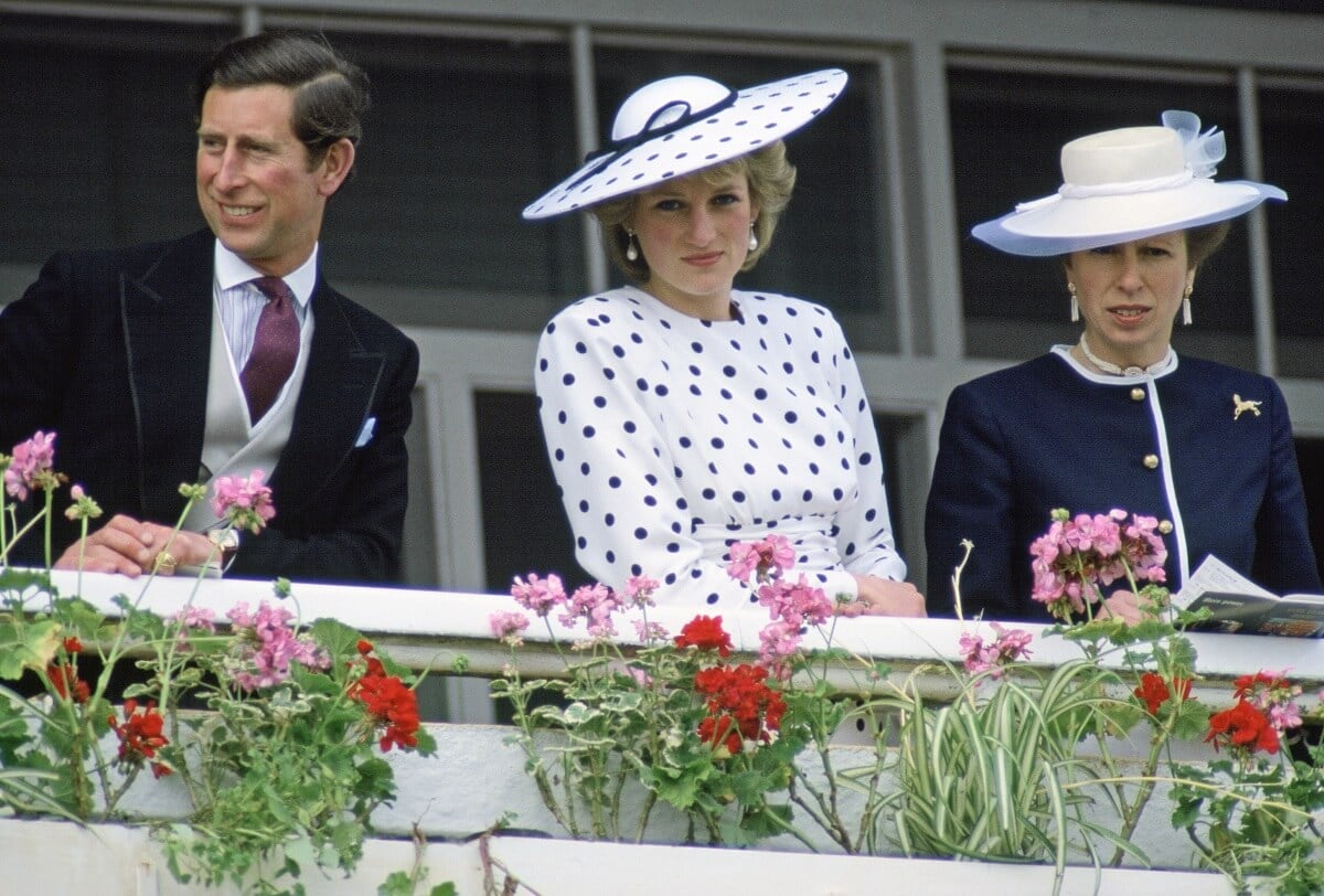 Princess Diana, who a body language expert says showed that she was 'fearless' and 'strong,' with then-Prince Charles and Princess Anne at The Derby in Epsom, Surrey (circa 1986)