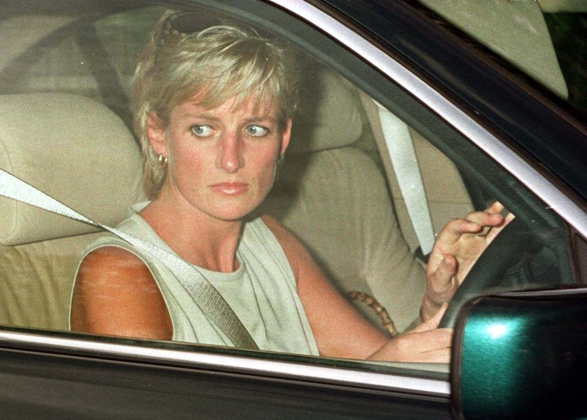 Princess Diana, whose chef has recalled the 'awful atmosphere' after her death, leaving in a car after attending a birthday party for Princess Beatrice (circa 1996)