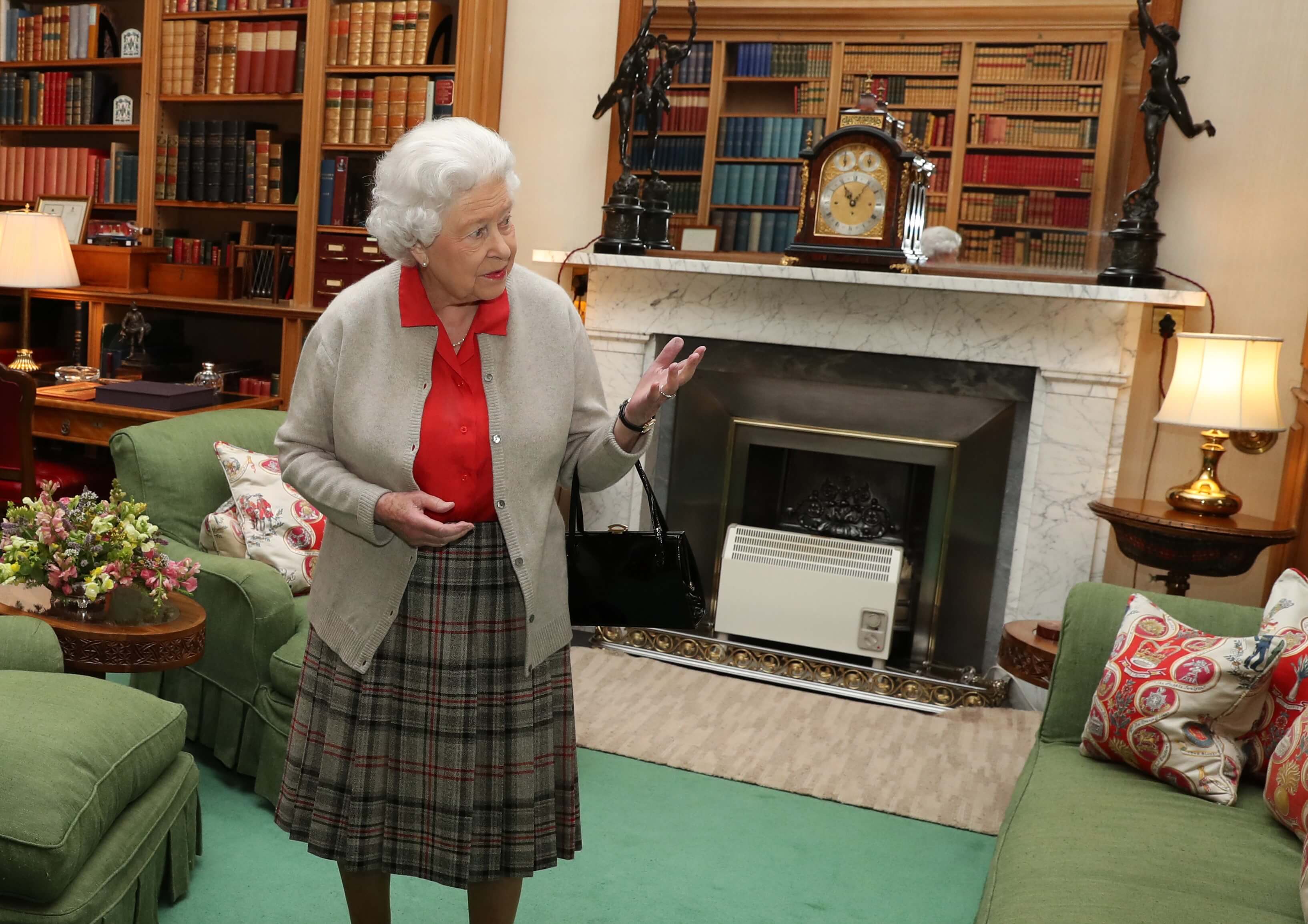 Queen Elizabeth II, who a aide says was 'caged at Buckingham Palace, during a private audience with Canadian governor at Balmoral Castle