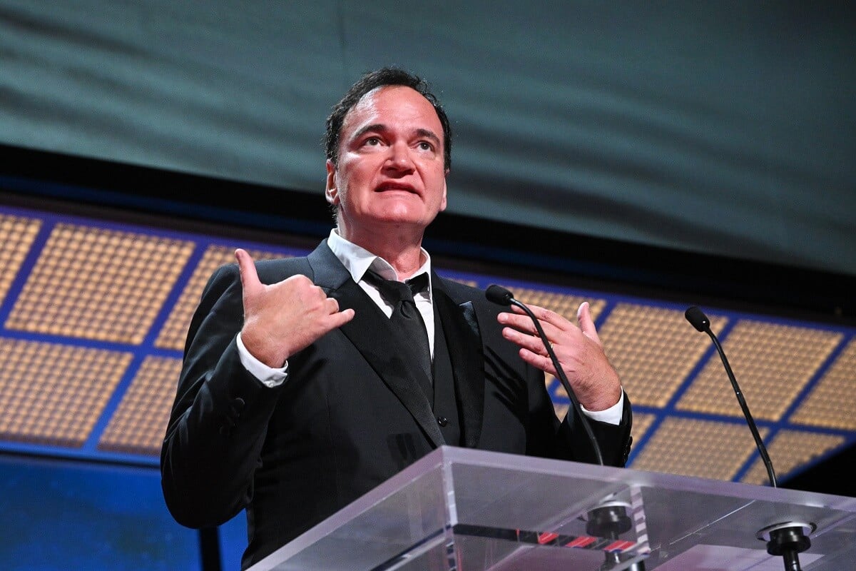 Quentin Tarantino speaking on stage at the closing ceremony during the 76th annual Cannes film festival