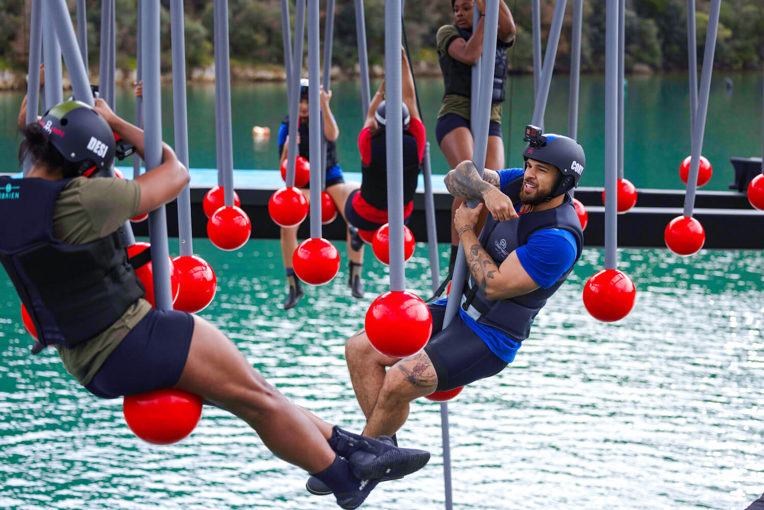 Cory and Desi from 'The Challenge: USA' Season 2 swinging over water during a challenge