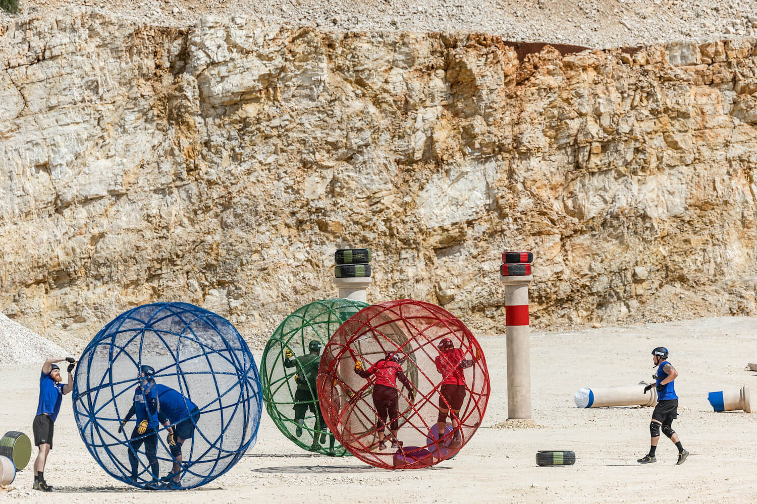 'The Challenge: USA' Season 2 Week 4 competitors competing during the daily challenge, which involves the cast members running in a large caged sphere