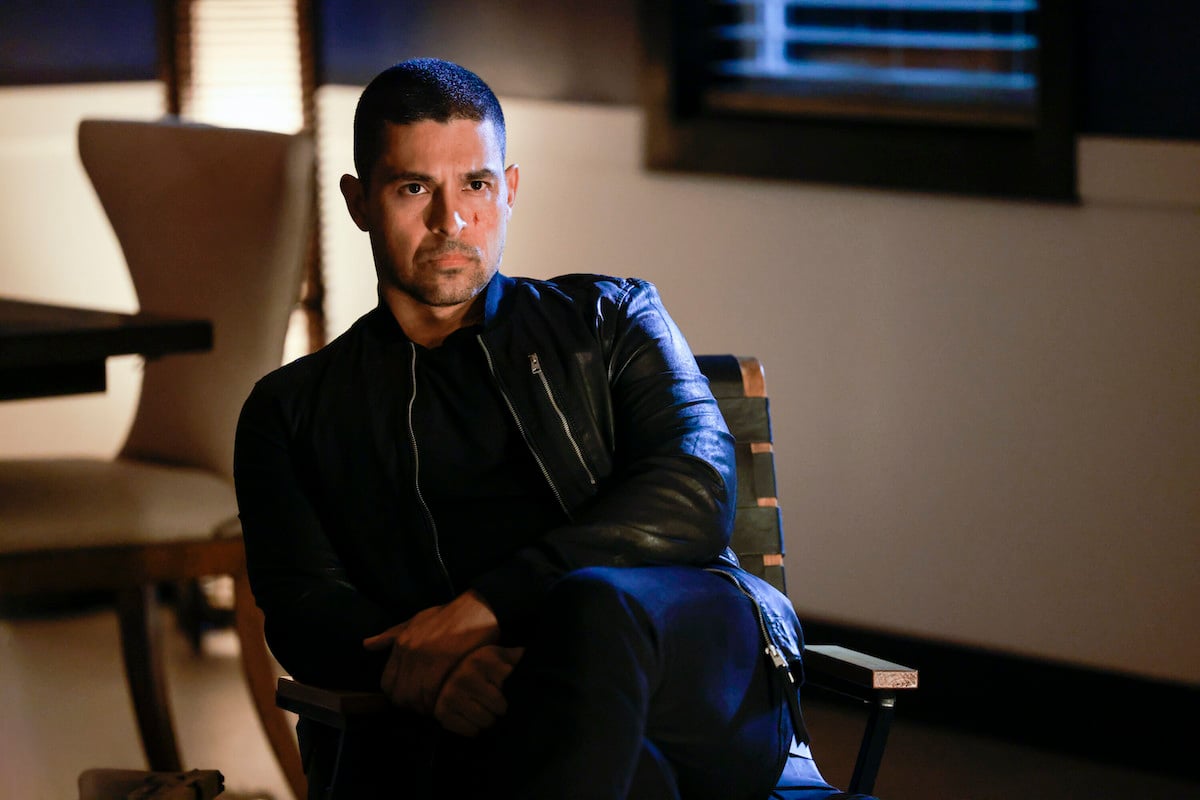 Wilmer Vanderrama sitting with his arms crossed in an episode of 'NCIS' Season 20