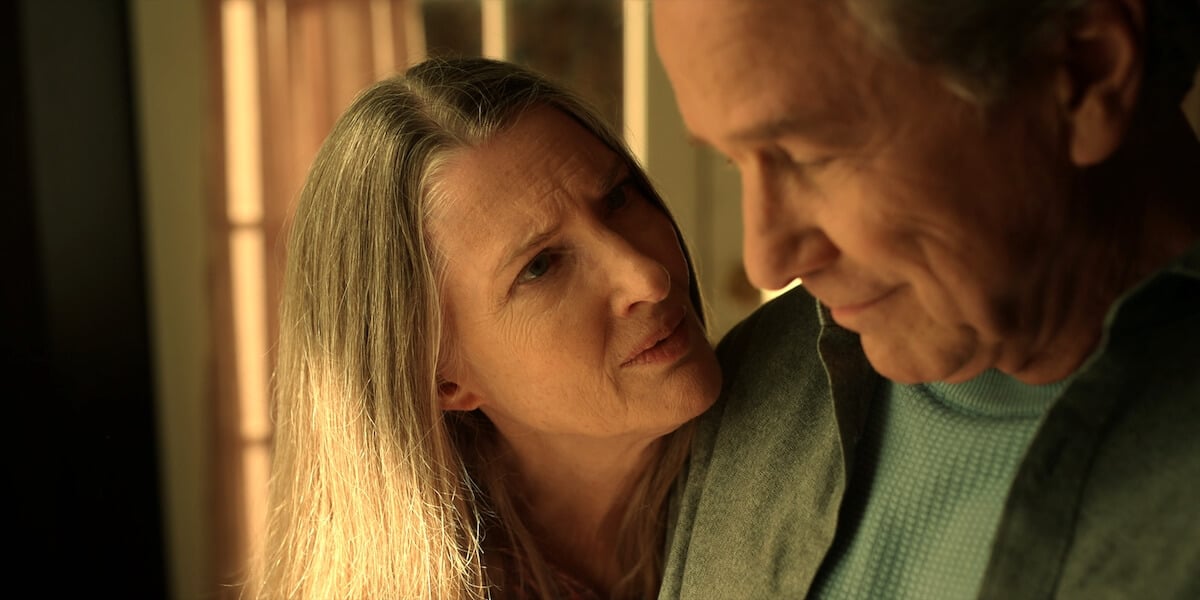Annette O'Toole as Hope looking intently at Tim Matheson as Doc in 'Virgin River' Season 5