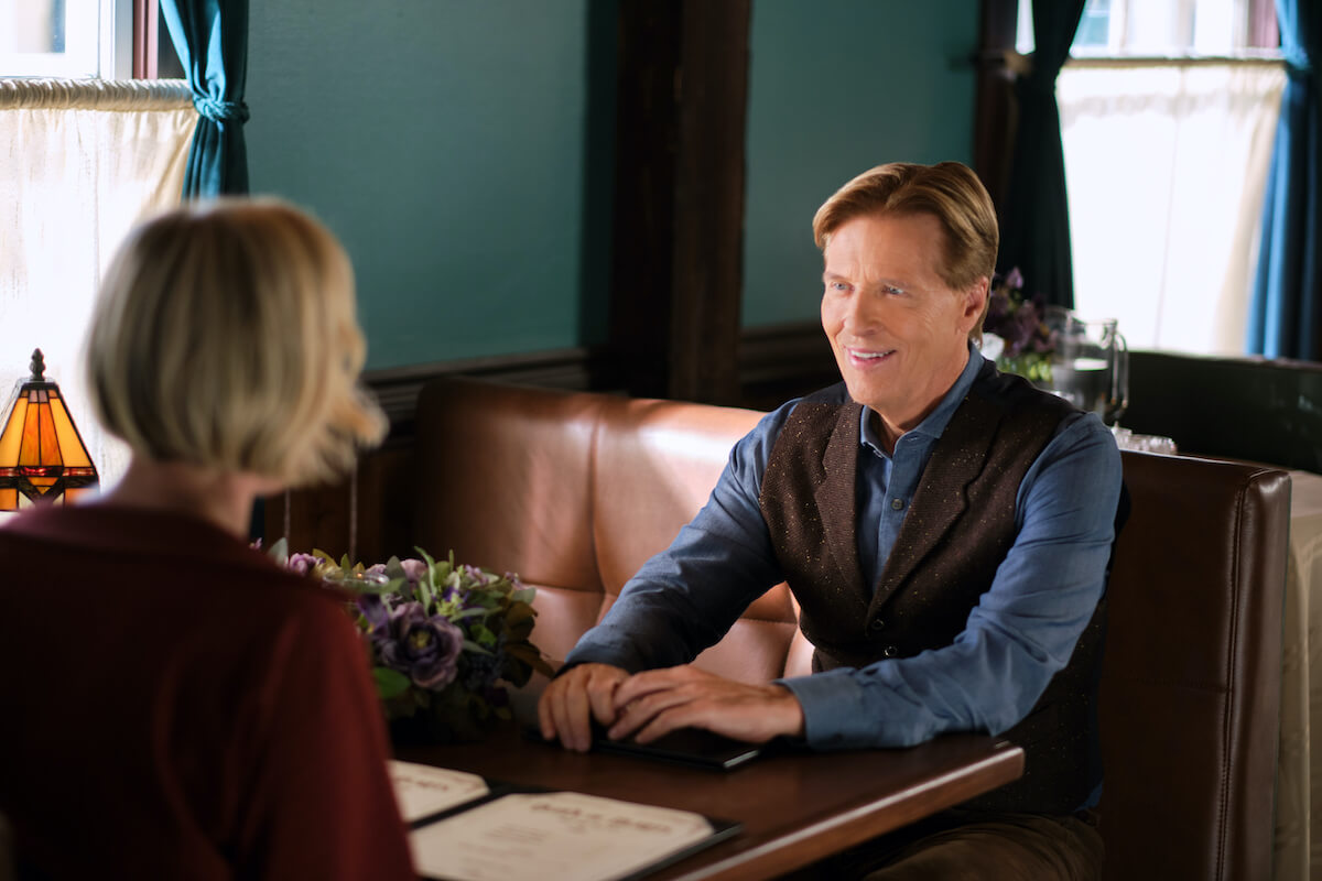 Madeline sitting across from Bill at a restaurant booth in 'When Calls the Heart' Season 10