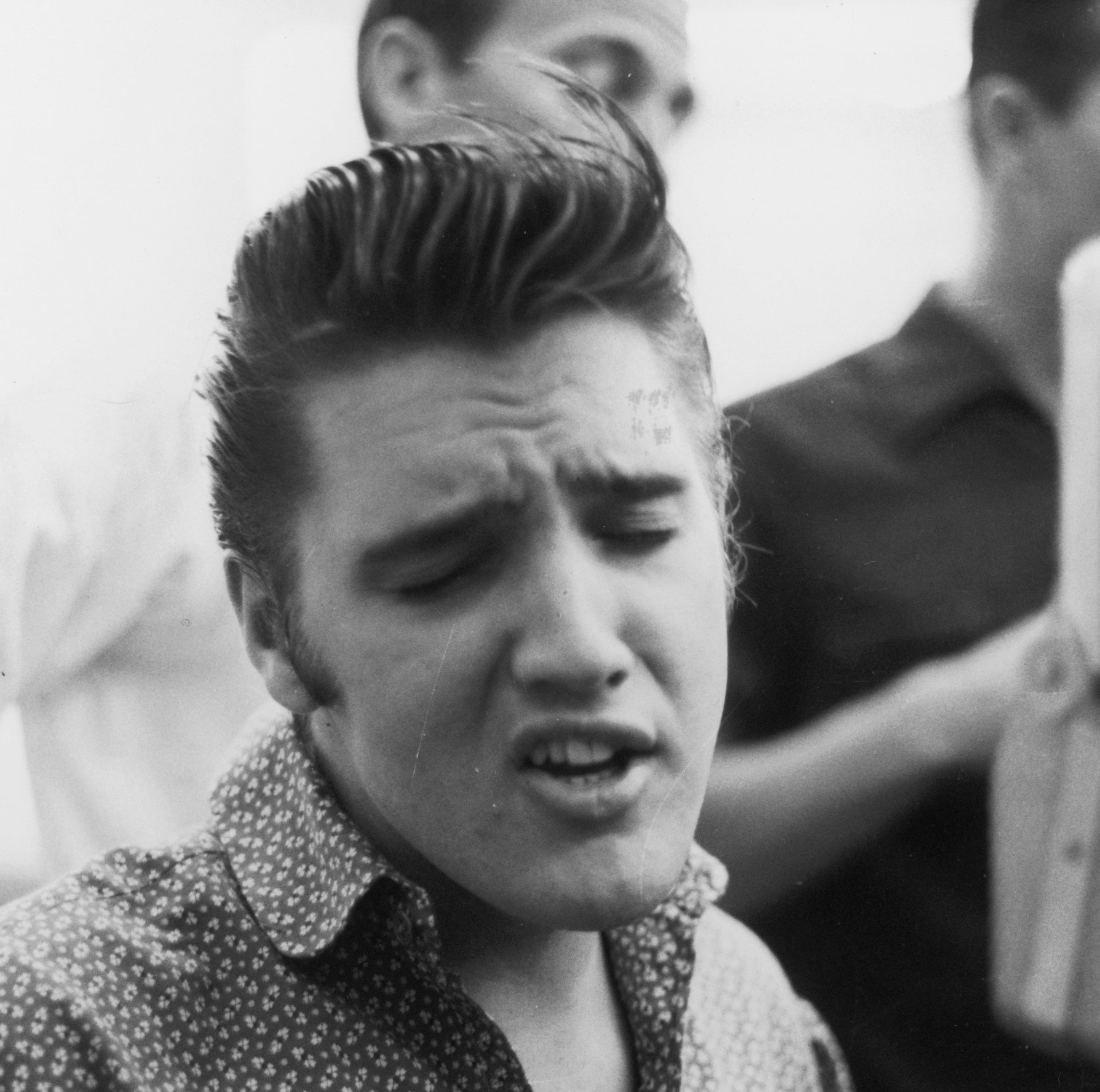 "Love Me" singer Elvis Presley curling his lip